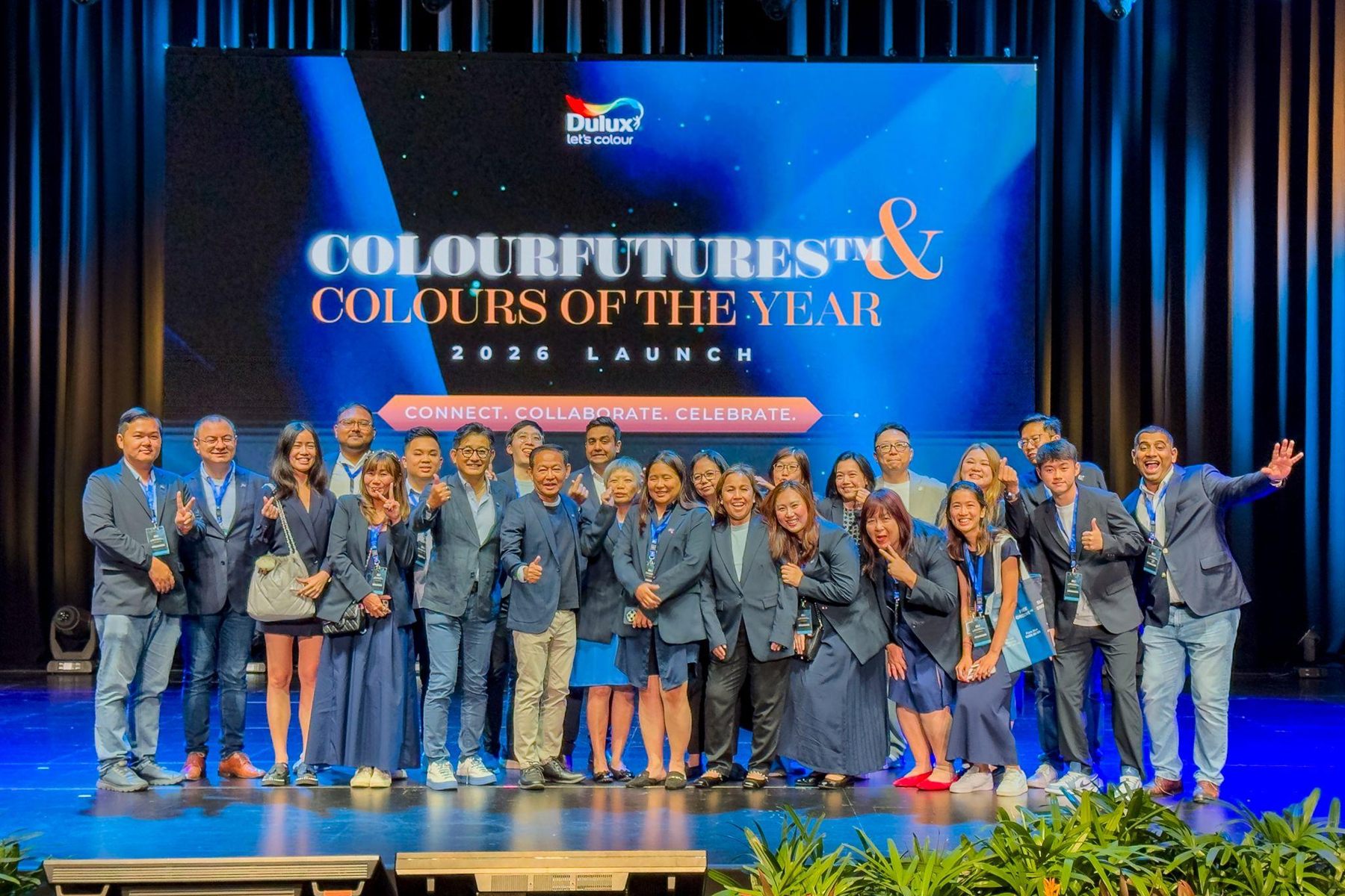 The full company on stage after the reveal, the 2026 Launch title and Connect. Collaborate. Celebrate. behind them