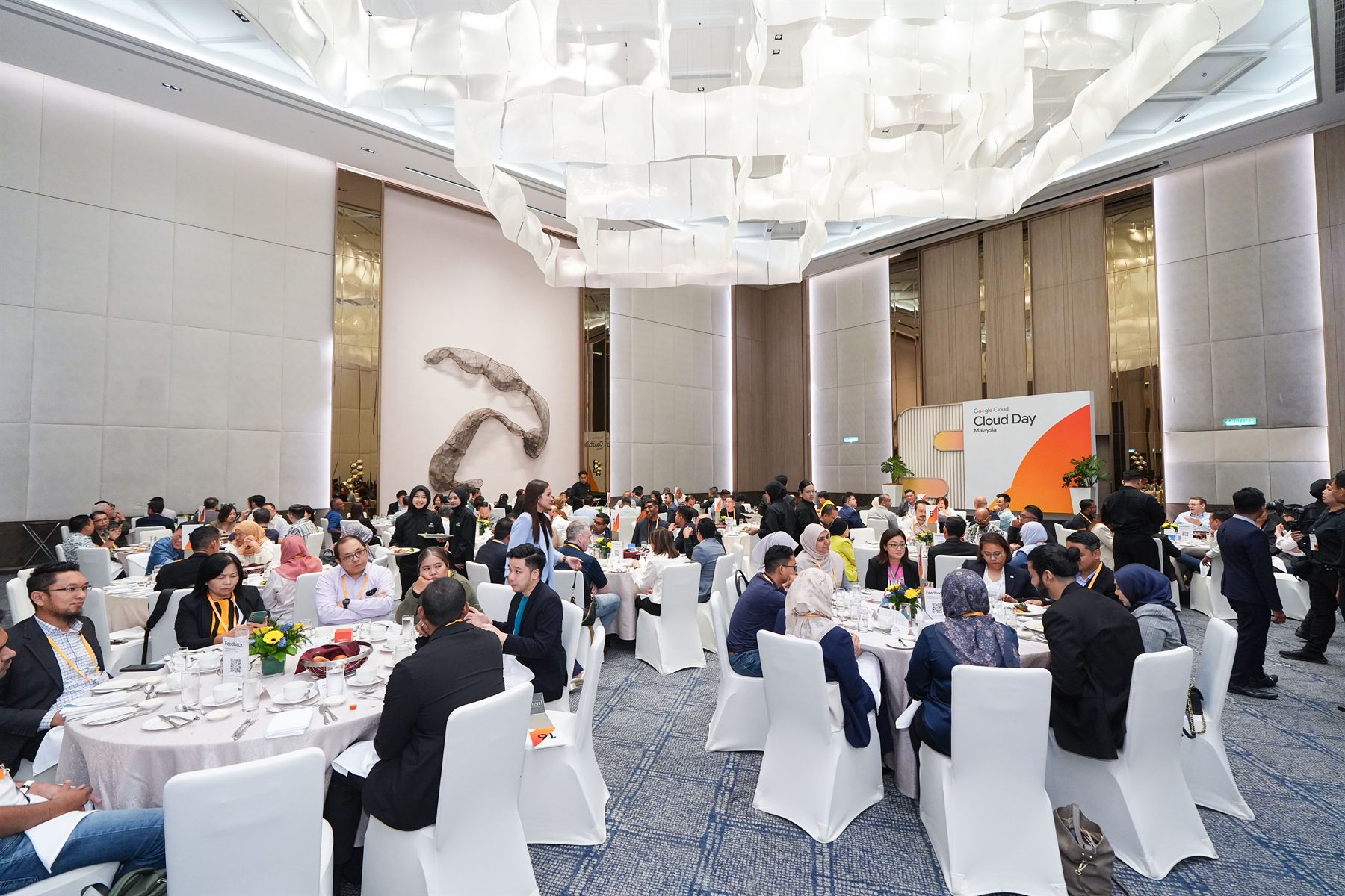 Guests at round tables during a conference executive lunch