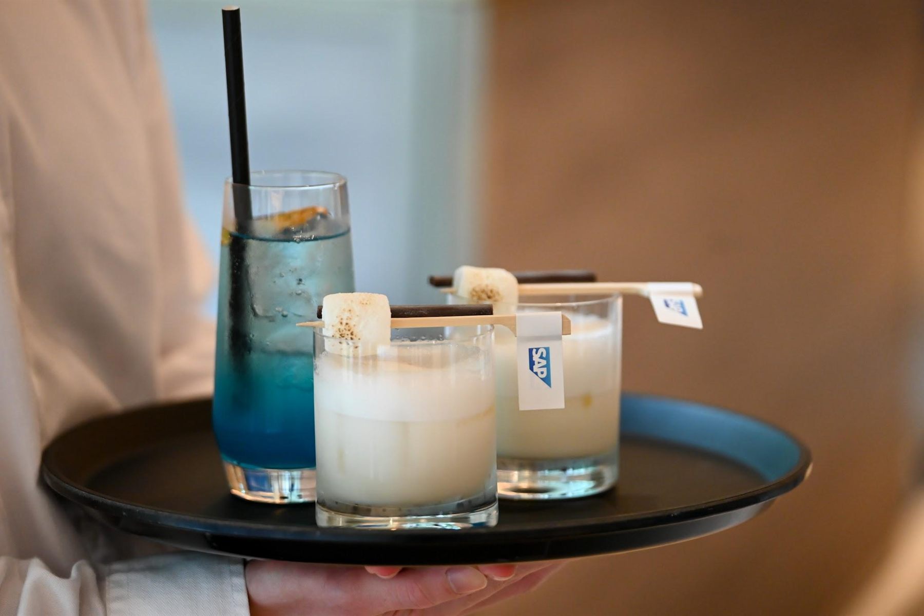Service detail: cocktails on a tray finished with SAP-branded flag picks